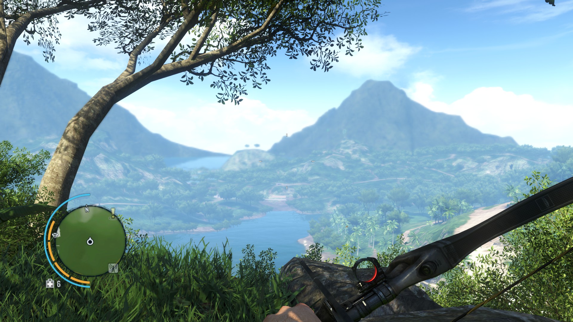 A hand holds a bow in front of a grassy cliffside. In the distance a lake is surrounded by pristine jungle, rising to volcanos and then, the sea.
