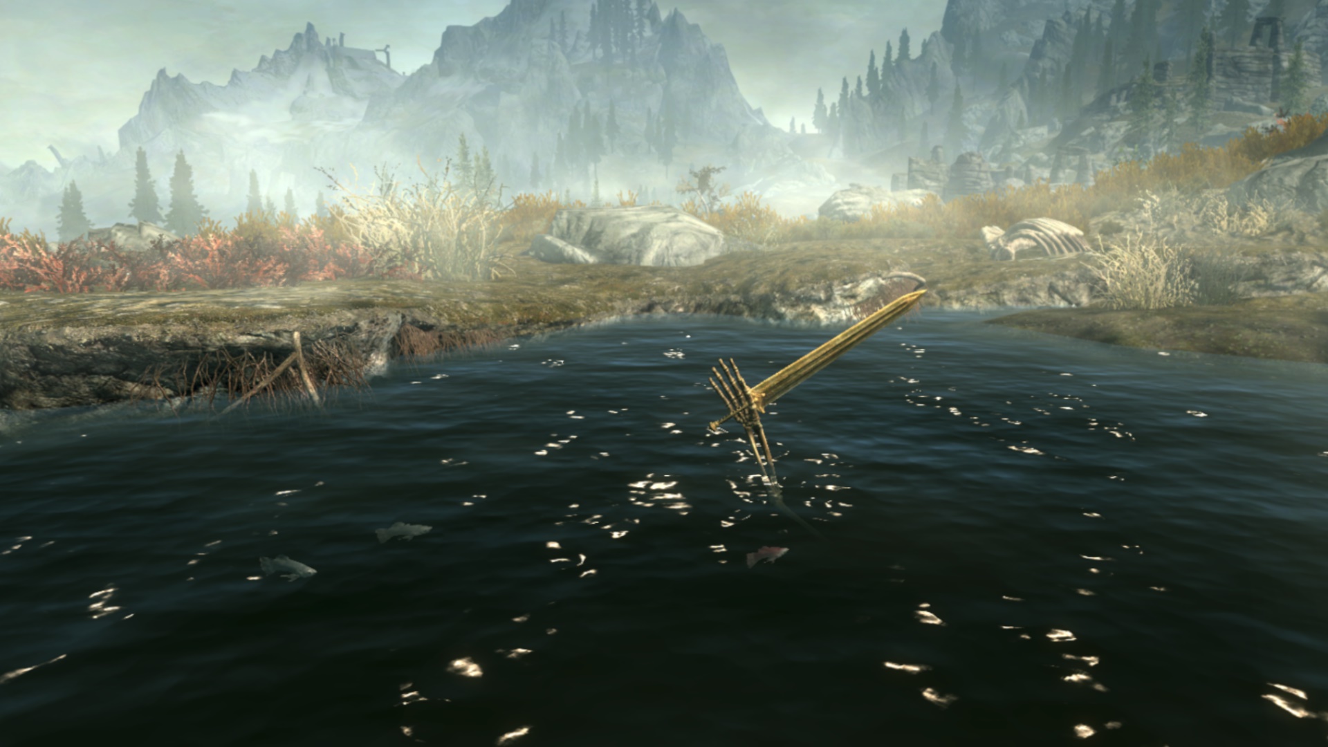 A pond. A skeletal hand holds a sword out of the pong. Mist-wreathed mountains are in the distance.